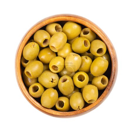 Photo for Pitted green olives for snacking, in a wooden bowl. Ready to eat, small table olives from Spain, processed after removing the kernel, preserved in brine. Used as a snack, as appetizer or as a garnish. - Royalty Free Image