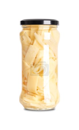 Pickled bamboo shoot slices in a glass jar with screw cap. Thin sliced bamboo shoot, pasteurized and preserved in vinegar brine and salt. Used in Thai cuisine for soup, stir-fries and salads. Photo