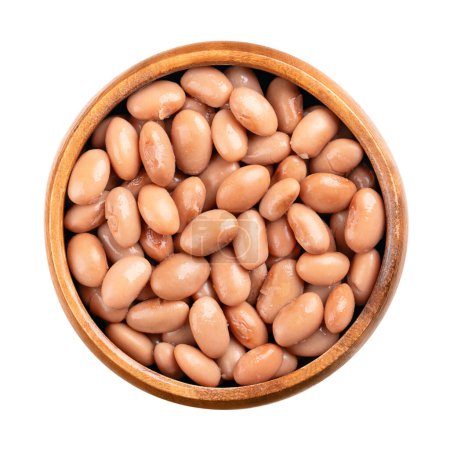 Borlotti beans in a wooden bowl. Cooked and canned cranberry beans, a hazelnut-colored variety of the common bean, Phaseolus vulgaris. Vegetarian staple food. Isolated, from above close-up food photo.