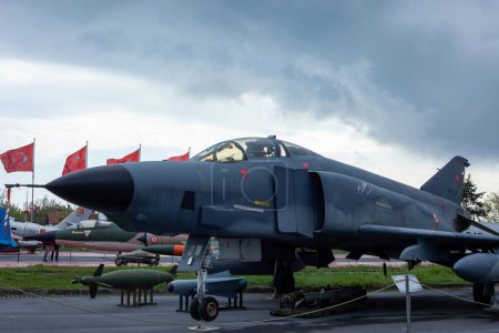 Photo for Istanbul, Yesilkoy - Turkey - 04.20.2023: F-4 Phantom Fighter Jet Plane, Supersonic jet Fighter and Bomber. Dark Clouds Background. - Royalty Free Image