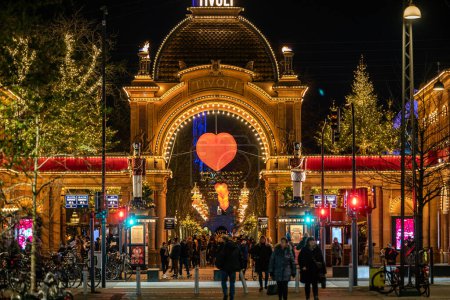 Photo for Copenhagen, Denmark The entrance to the Tivoli Gardens amusement park at night. - Royalty Free Image