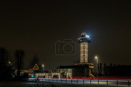 Photo for Copenhagen, Denmark The lit-up tower and exterior of the Zoo. - Royalty Free Image