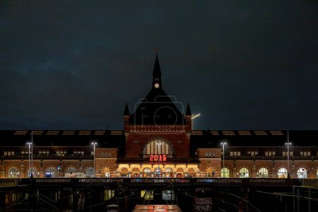 Photo for Copenhagen, Denmark The facade of  the Central Station at night and the famous digital clock. - Royalty Free Image
