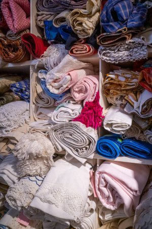 Photo for Copenhagen, Denmark Stacks of messy vintage cloth and textiles. - Royalty Free Image