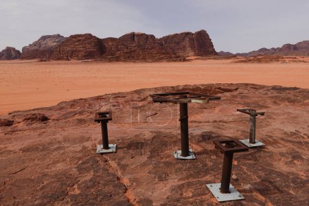 Photo for Wadi Rum, Jordan An old decrepid picnic area with table and chairs on a desert rock. - Royalty Free Image