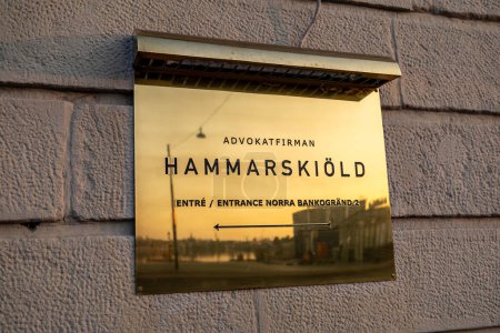 Stockholm, Sweden July 1, 2023 A large brass plaque for the Hammarskiold law firm.