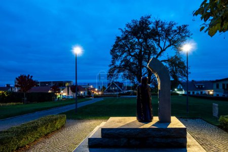 Photo for Bastad, Sweden Oct 29, 2023, A statue of the famous Opera singer Birgit Nilson in a public park at night from 2013 by Ulla och Gustav Kraitz - Royalty Free Image