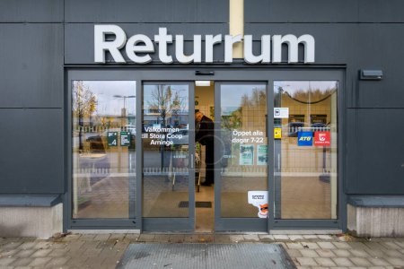 Photo for Stockholm, Sweden Nov 9, 2023 A man redeems aluminum cans and bottles in the Arninge Station shopping center and a sign in Swedish saying: Return Room. - Royalty Free Image