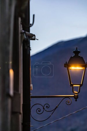 Secinaro, Italy A street lamp and a mountain in the background.