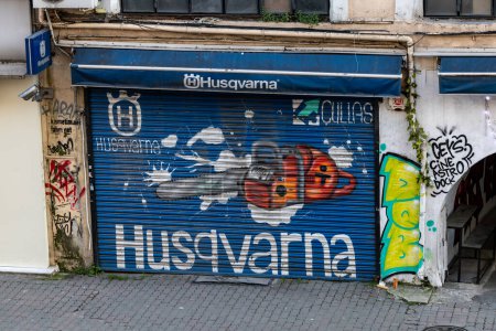 Photo for Istanbul, Turkey March 17, 2024 A storefront with the Swedish Husqvarna logo handpainted on the entrance. - Royalty Free Image