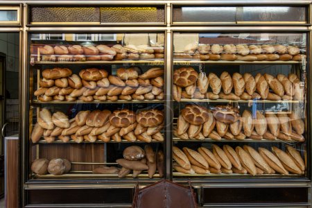 Photo for Istanbul, Turkey March 18, 2024 Loaves of bread in the window of a bakery in the Balat district. - Royalty Free Image