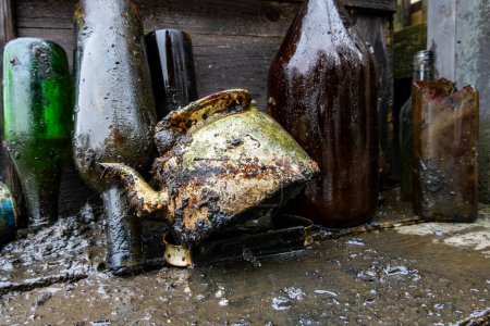 Stockhom, Sweden April  1, 2024 Glass bottles and a teapot picked up by  scuba divers picking up trash from the bottom of the Palsundet canal in downtown Stockholm.