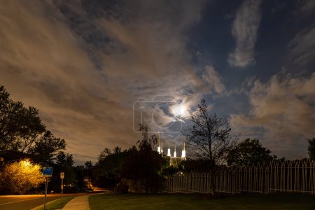 Photo for Kensington, Maryland  April 26, 2024 A moonscape at night and the towers of the Mormon Temple, or the Washington D.C. Temple - Royalty Free Image