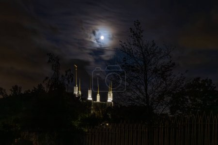 Photo for Kensington, Maryland  April 26, 2024 A moonscape at night and the towers of the Mormon Temple, or the Washington D.C. Temple - Royalty Free Image