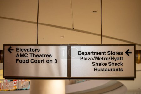 Photo for Tysons Corner, Virginia May 1, 2024 A sign in the Tysons Corner Center or shopping mall, points to elevators, metro, restaurants, food court. - Royalty Free Image