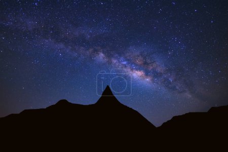 Photo for Starry night sky with high moutain and milky way galaxy with stars and space dust in the universe - Royalty Free Image