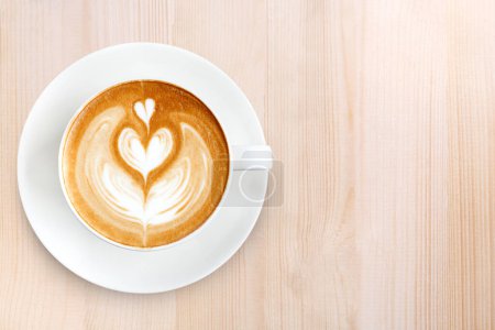 Foto de Vista superior café latte arte sobre fondo de madera - Imagen libre de derechos