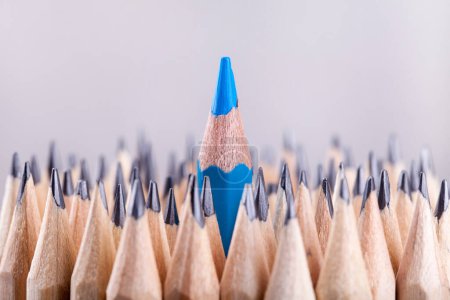Photo for One sharpened blue pencil among many ones - Royalty Free Image