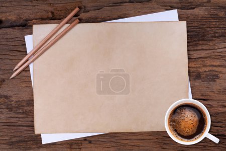 Photo for Old blank paper and a cup of coffee on woode - Royalty Free Image
