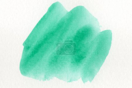 Foto de Acuarela verde abstracta sobre fondo blanco.El color que salpica en el papel.Es una mano dibujada
. - Imagen libre de derechos