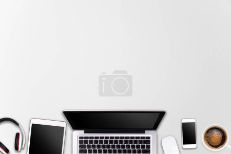 Photo for Modern workspace with laptop tablet, smartphone and coffee cup copy space on wood background. Top view. Flat lay style. - Royalty Free Image