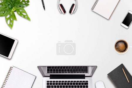 Photo for Modern workspace with laptop tablet, smartphone and coffee cup copy space on color background. Top view. Flat lay style. - Royalty Free Image
