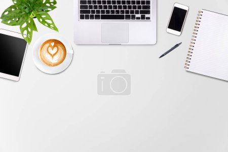 Photo for Modern workspace with laptop tablet, smartphone and coffee cup copy space on white wood table background. Top view. Flat lay style. - Royalty Free Image