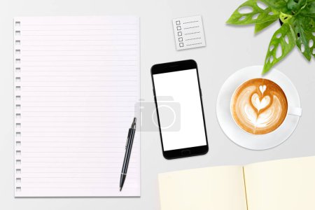 Photo for An open blank notebook, smartphone with pen and a cup of latte coffee on wooden table - Royalty Free Image