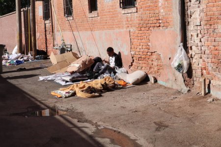 Photo for El Paso, TX, USA, May 10th, 2023. Immigrants sleeping in an alley, waiting to approved to enter the USA under Title 42. - Royalty Free Image