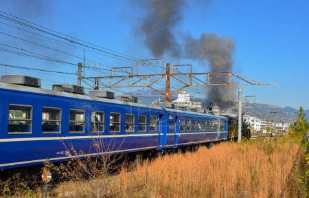 Photo for Gunma, Japan - Nov 9, 2019. A steam train carrying tourists in Gunma, Japan. The railway industry in Japan is culturally and historically significant. - Royalty Free Image