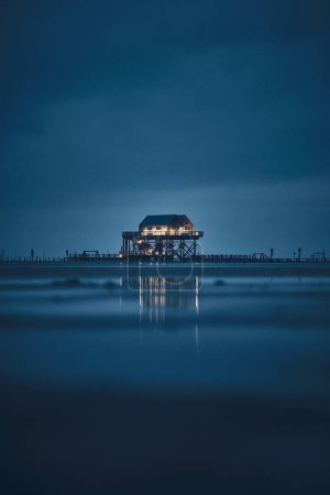 stilt house at sankt peter-ording germany at night. High quality photo 