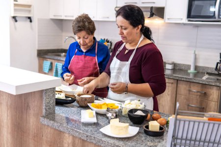 Photo for Two women cooking vegetables in the kitchen. High quality photo - Royalty Free Image