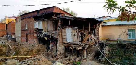 Foto de Half-destroyed House. Abandoned Demolished Building in Russia. - Imagen libre de derechos