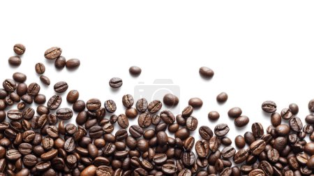 Roasted coffee beans scattered across a white background, some isolated and others in clusters 