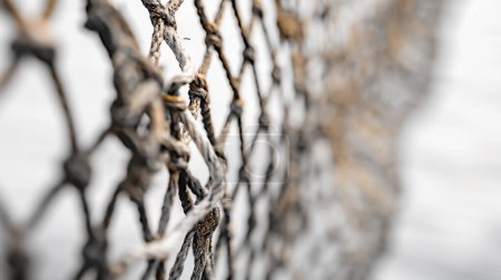 Photo for Close-up of a weathered net with selective focus, revealing texture and patterns. - Royalty Free Image