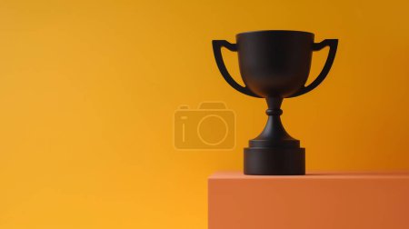 Téléchargez les photos : Coupe trophée noir mat sur un piédestal orange avec un fond jaune-orange vif. - en image libre de droit