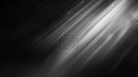 Imagen monocromática de rayos de luz con partículas de polvo, creando una sensación de movimiento en la oscuridad.