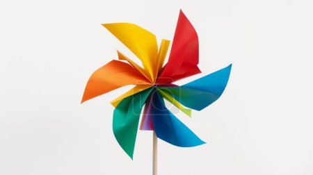 A colorful paper pinwheel with vibrant panels in red, orange, yellow, green, blue, and purple, mounted on a simple stick, set against a pure white background.