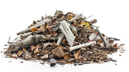 A heap of natural debris isolated on a white background, consisting of various elements like driftwood, leaves, rocks, and bark, symbolizing decay and the cycle of nature.