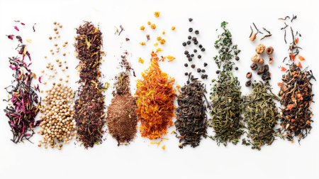 An assortment of colorful spices and dried herbs arranged in neat piles on a white background.