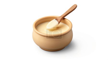 Photo for A small ceramic pot filled with smooth, creamy custard. A wooden spoon rests on top, ready to serve the delicious dessert. - Royalty Free Image