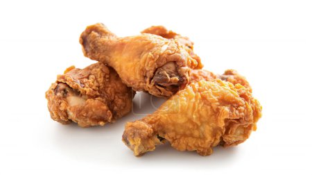Three crispy, golden-brown fried chicken drumsticks stacked together on a white background.
