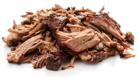 A pile of shredded, cooked pulled pork with a brown, crispy outer layer on a white background.