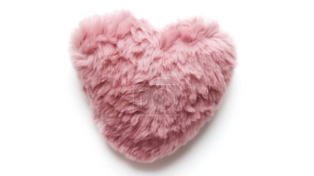Una almohada rosa esponjosa en forma de corazón sobre un fondo blanco, que evoca una sensación de calidez y afecto.