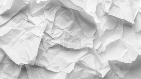 White crumpled paper with varying folds and creases, creating a textured and abstract appearance.
