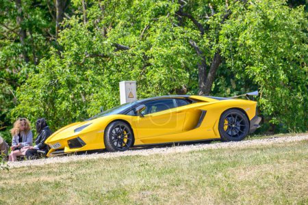Photo for Yellow sports car on the river bank - Royalty Free Image