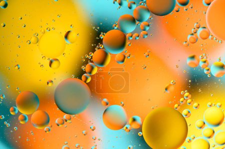 Foto de Manchas azules y anaranjadas con círculos multicolores similares a la galaxia y al microcosmos 3 - Imagen libre de derechos