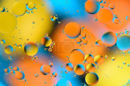 Foto de Manchas azules y anaranjadas con círculos multicolores similares a la galaxia y al microcosmos 7 - Imagen libre de derechos
