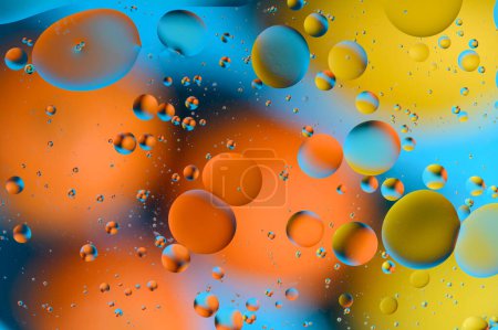 Foto de Manchas azules y anaranjadas con círculos multicolores similares a la galaxia y al microcosmos 8 - Imagen libre de derechos