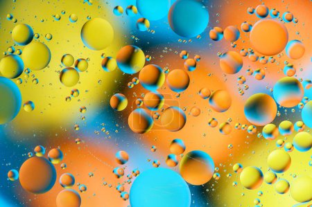 Foto de Manchas azules y anaranjadas con círculos multicolores similares a la galaxia y al microcosmos 15 - Imagen libre de derechos